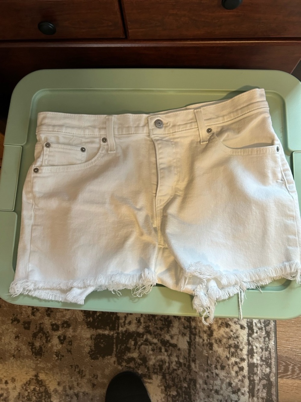 Women’s size 32 - Levi cut offs - white